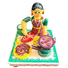 LADY MAKING APPAM