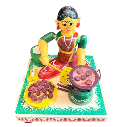 LADY MAKING APPAM
